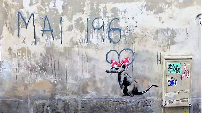 Image: In one of the new Banksy works addressing the pain of migrants in Paris the artist uses his trademark rat to remind the French of their revolutionary past