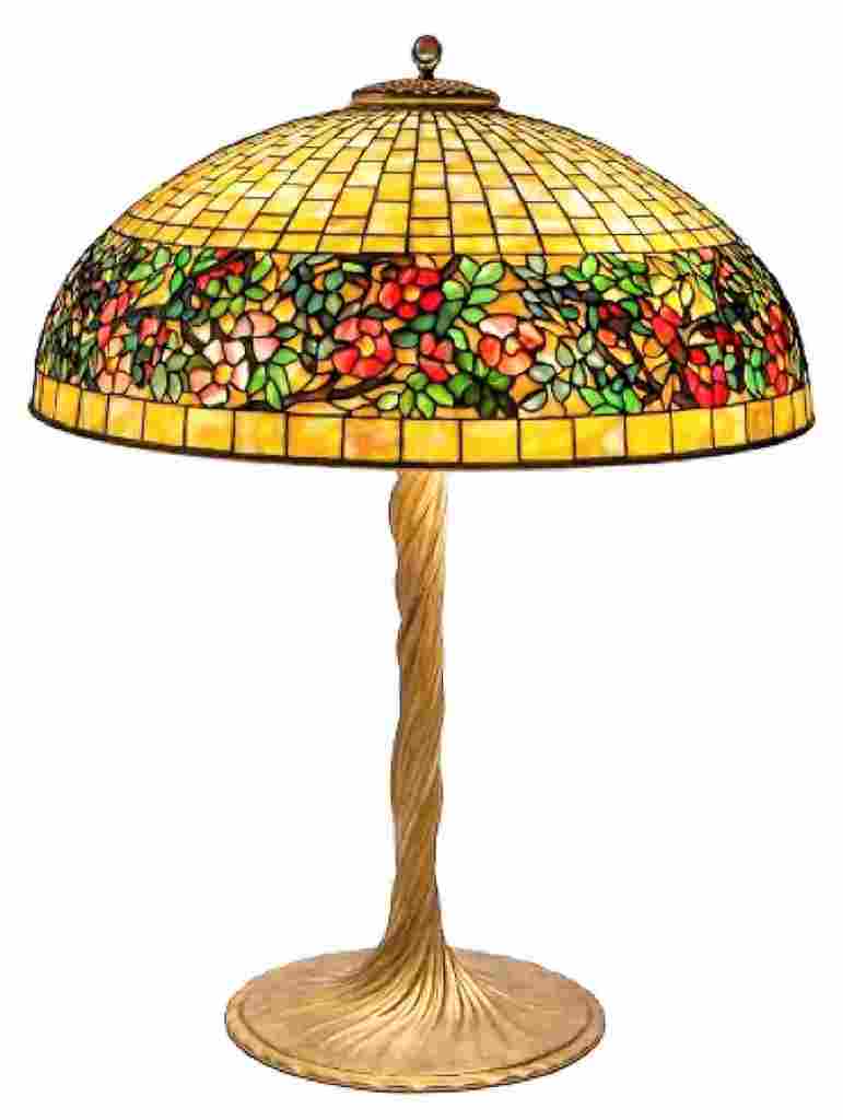 Image: Tiffany Studios Belted Rose Table Lamp, circa 1910. 27.5 in. x diameter: 20 in on display at the Ophir Gallery booth during the Baltimore Art, Antique & Jewelry Show 