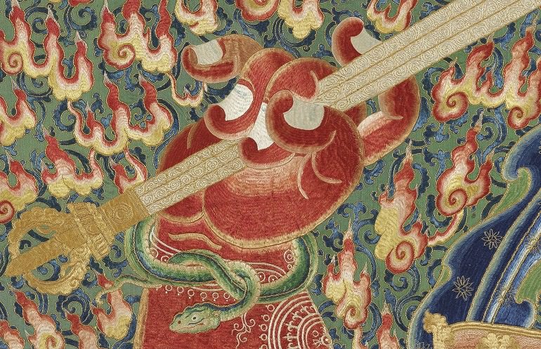 Image: A section of the Imperial Embroidered Silk Thangka Yongle bought by  Liu Yiqian shows a hand holding a sword 