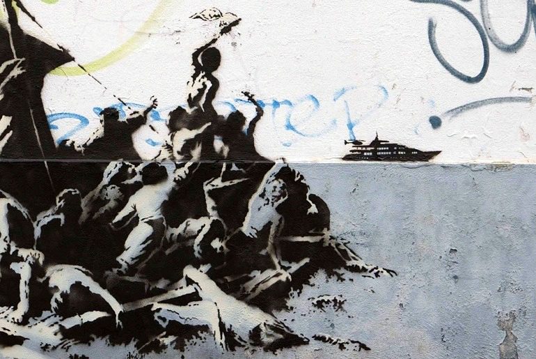 Image: Banksy,' We're not all in the same boat' show the plight of Syrian refugee s