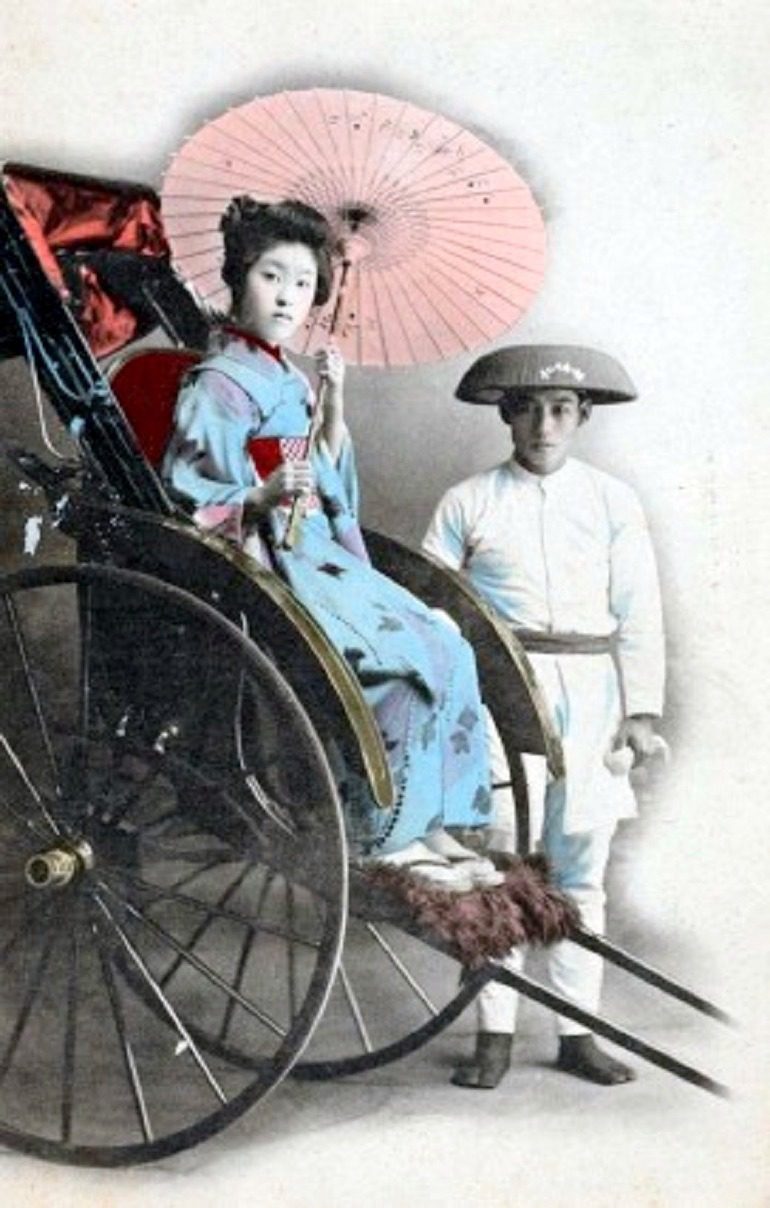 Image: Studio Portrait of Young Woman in Ricksaw Posed with Driver, 1907-1918, one of the images in the New York Public Library collection. The Images Capture Japanese Culture