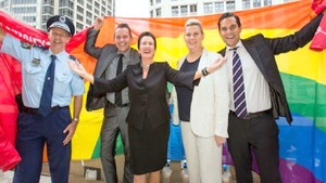 Image: City of Sydney officials Wrapped in the Rainbow Flag, celebrating LGBT RIGHTS