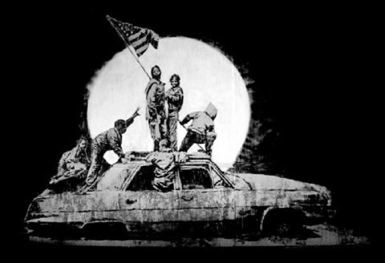 Image: Flags by Banksy, is one of the works on display in War, Capitalism & Liberty in Rome