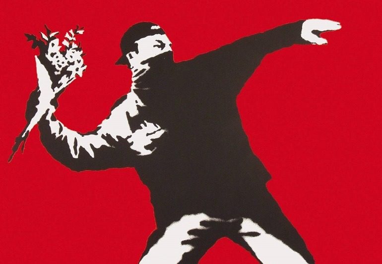 Image: Love is in the Air by Banksy, is one of the works on display in War, Capitalism & Liberty in Rome 