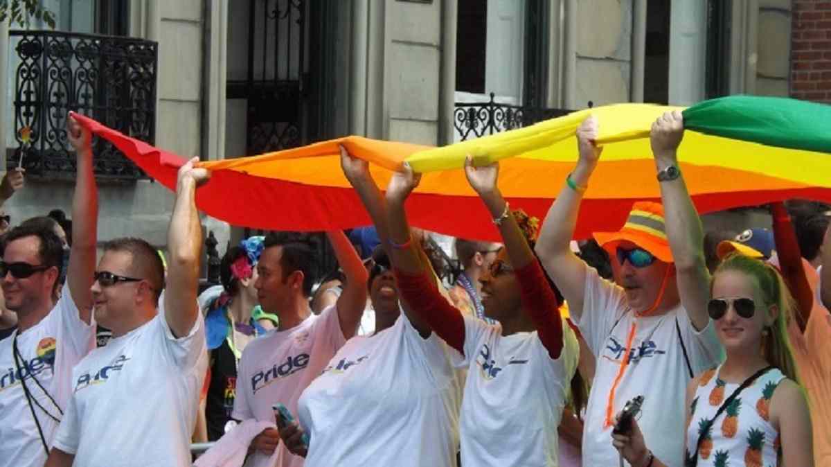 People celebrating during the Baltimore Gay Pride Parade that brought together the LGBT Community and friends under the rainbow flag