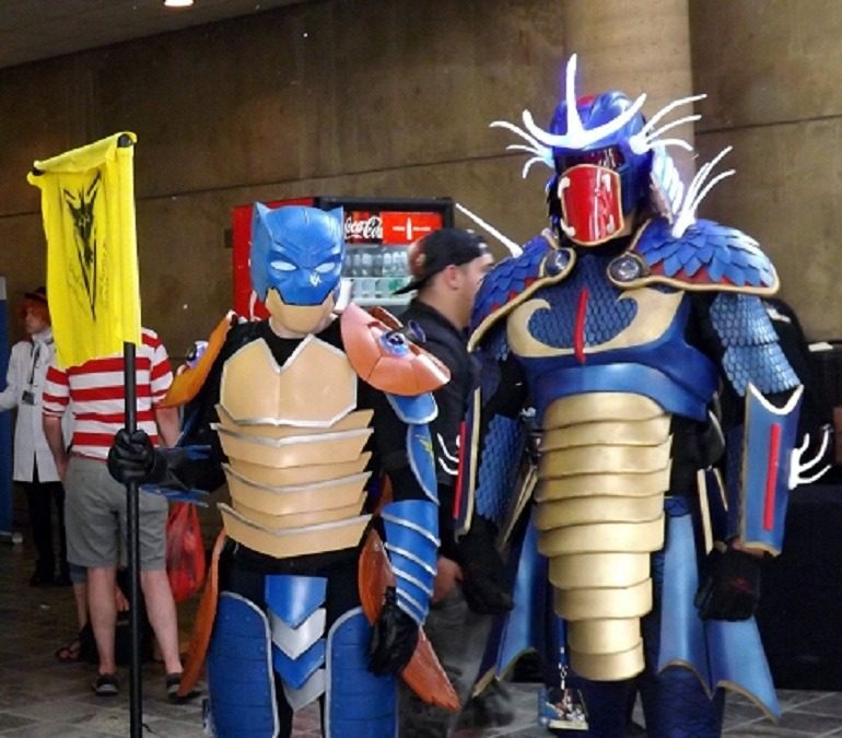 Image: Two anime Otakon fans present their costumes to the crowd during Cosplay Costume Parade- 700 x 675