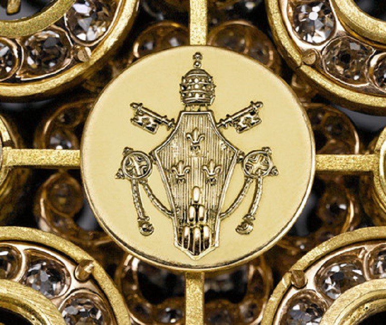 Image: The Papal shield of Pope Paul VI adorns the reverse of Pope Paul VI's Diamond Cross shows the exquisiteness of the cross that is one of the vintage antiques from M.S. Rau Antiques at the Baltimore Art, Antique & Jewelry Show