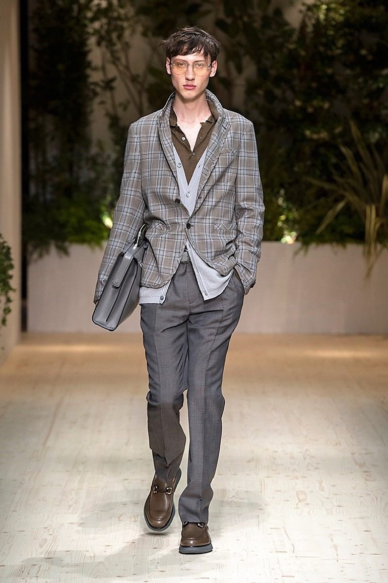 Image: A male model in formal wear on the runway during the launch of Salvatore Ferragamo Men’s Spring Summer 2018 collection -01