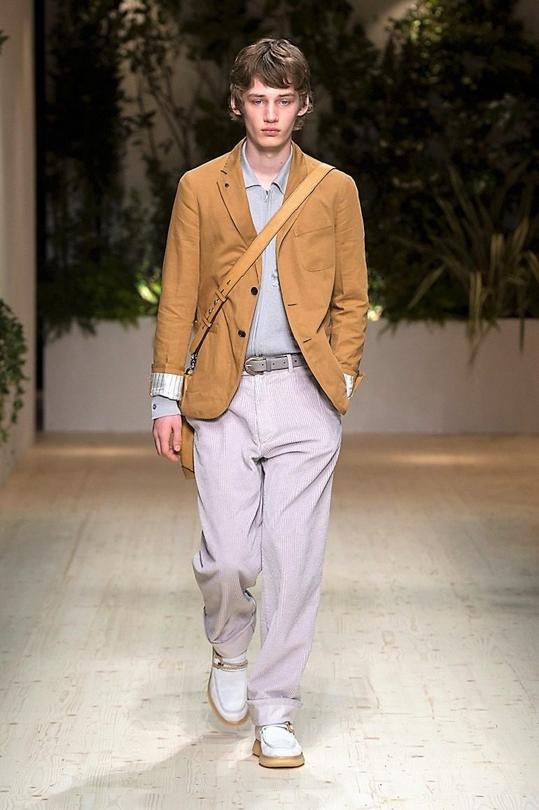 Image: A male model in brown jacket and a gray pant on the runway during the launch of Salvatore Ferragamo Men’s Spring Summer 2018 collection -03