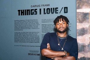 Image: Winner 7th Bombay Sapphire Artisan Series, Darius Frank, standing by the wall text of his exhibition 'Things I Loved' in Washington DC