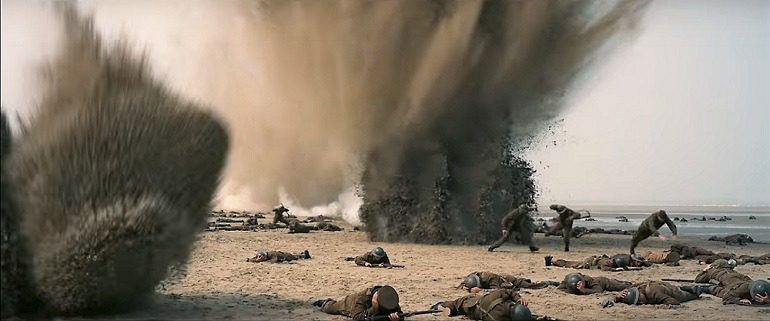 Image: Explosion at the beach sends soldiers diving in Dunkirk, a  film by  Christopher Nolan that  continues to gain tremendous popularity across the globe