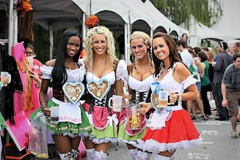 Image: Dressed in German costumes some beautiful ladies enjoy Baltimore Beer Festival during das best oktoberfest