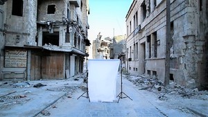 Image: A white canvas backdrop placed in the center of destruction marked the beginning of Iranian photographer Amir Kabir Jabbari's examination of the Syrian civil war and its impact on children