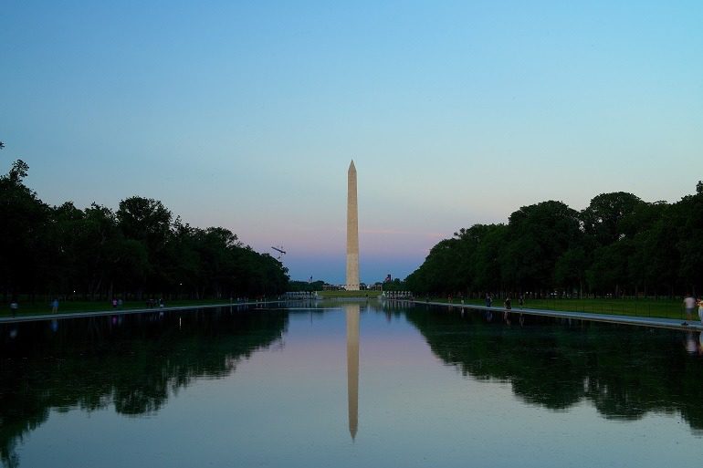 Image: The Washington Monument stands tall at dusk inviting those on vacation in DC for a visit