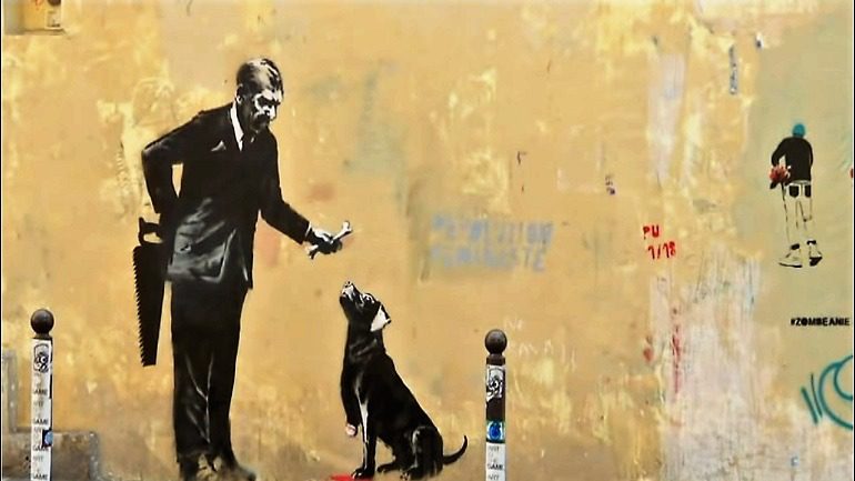 New Banksy Works in Paris Take on Migrant Issues