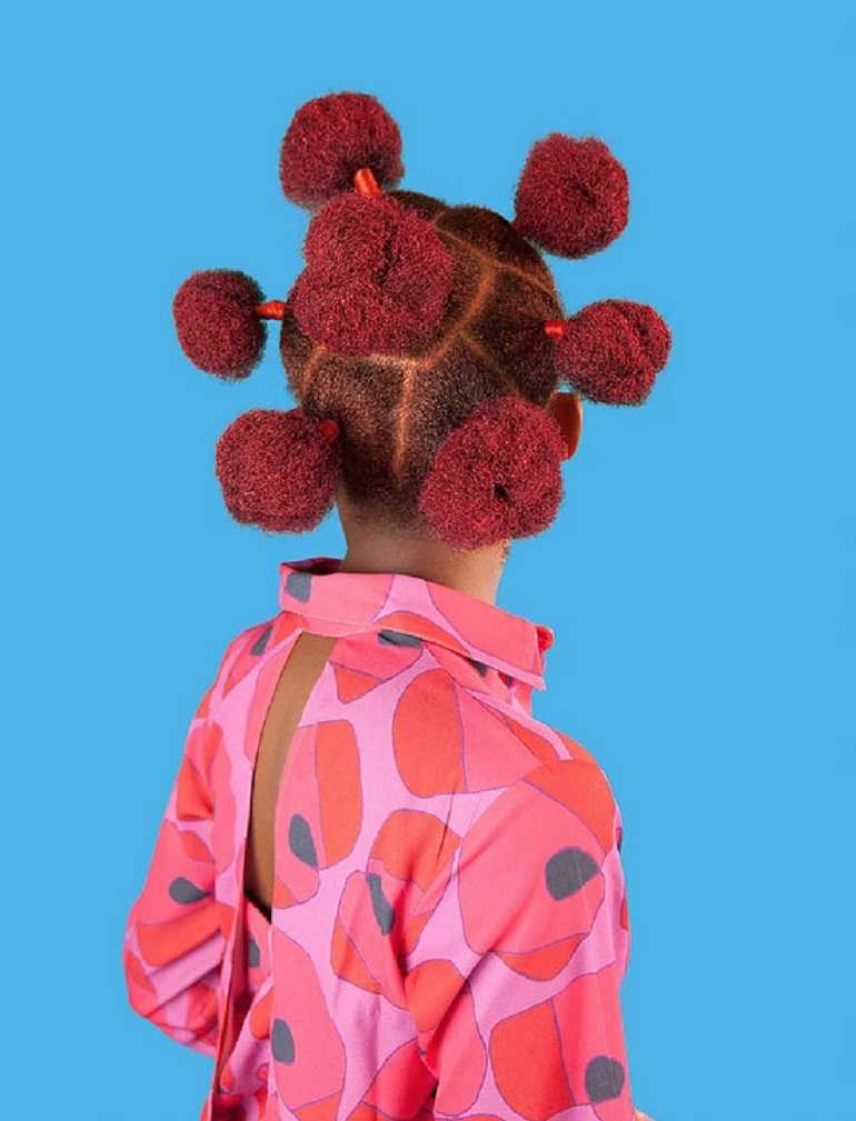 Image: Pink Buns, a pigment print of an Nigerian hairstyle by Medina Dugger addressing how black women are perceived on display at Catherine Edelman Gallery in Chicago 2015