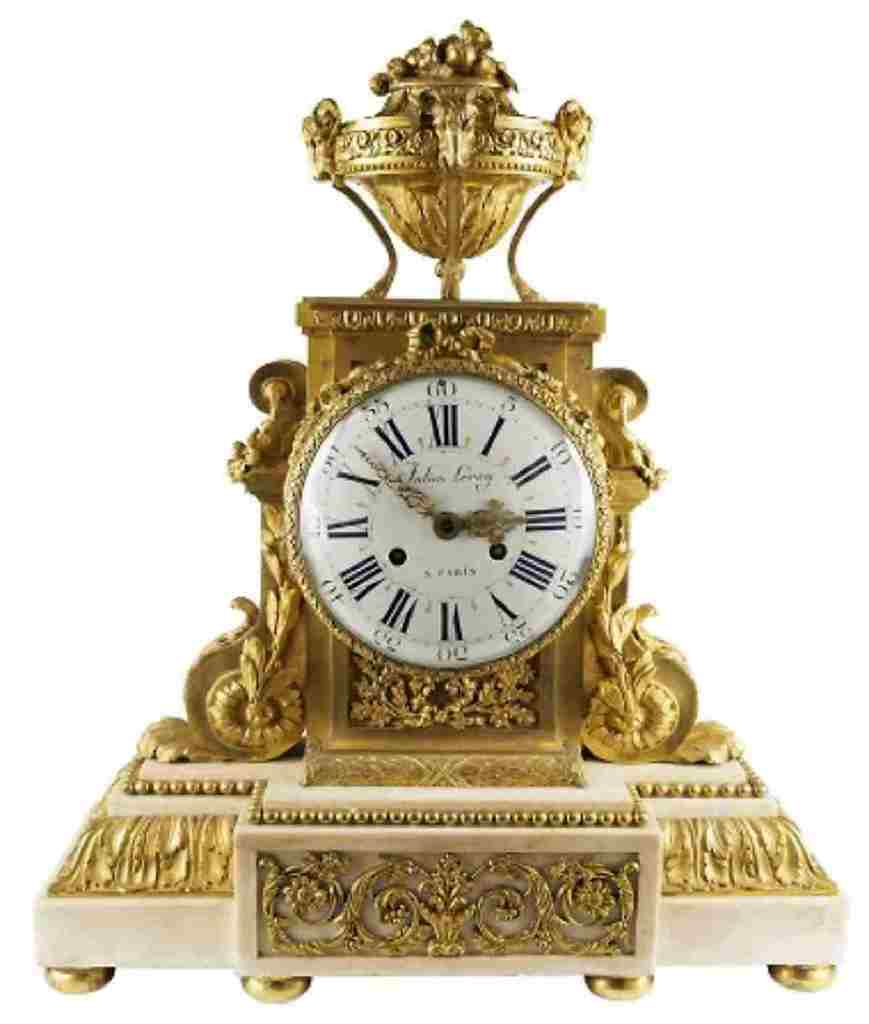 Image: A French Louis XVI Ormolu Mounted Mantel Clock, Leroy measuring 24 in. H x 20 in. W x 7.5 in on display in  Nicolo Melissa Antiques booth