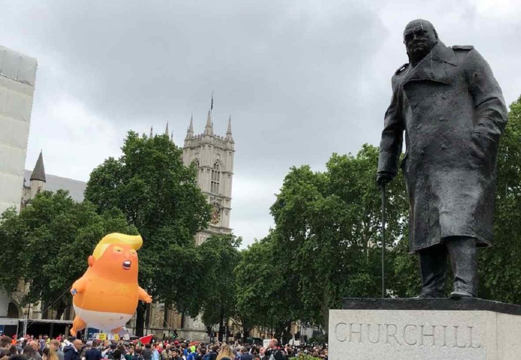 Trump Baby protest blimp with protestors against United States President Donald Trump gathering on Parliament Square