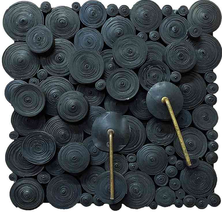 Fragments 2019, a relief sculpture by Patrick Bongoy made from recycled rubber on wooden board