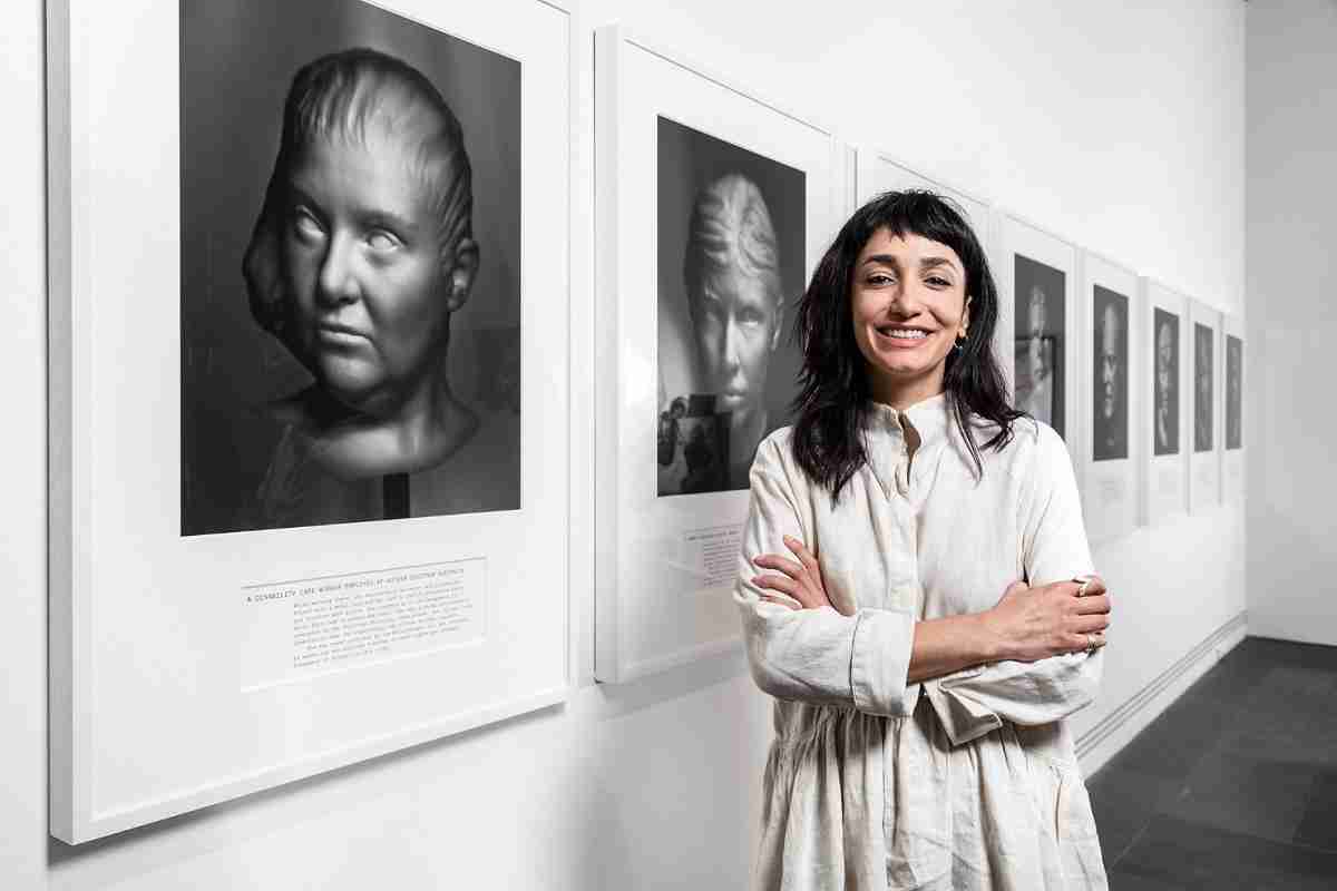 Hoda Afshar with her and a series of nine photographic portraits artwork celebrating whistleblower