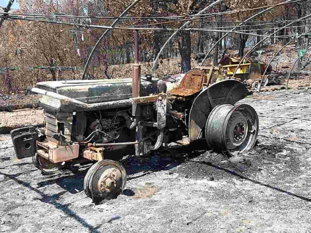 Burnt tractor in Saint Cannat, France, an aftermath of devastating wildfires destruction photographs