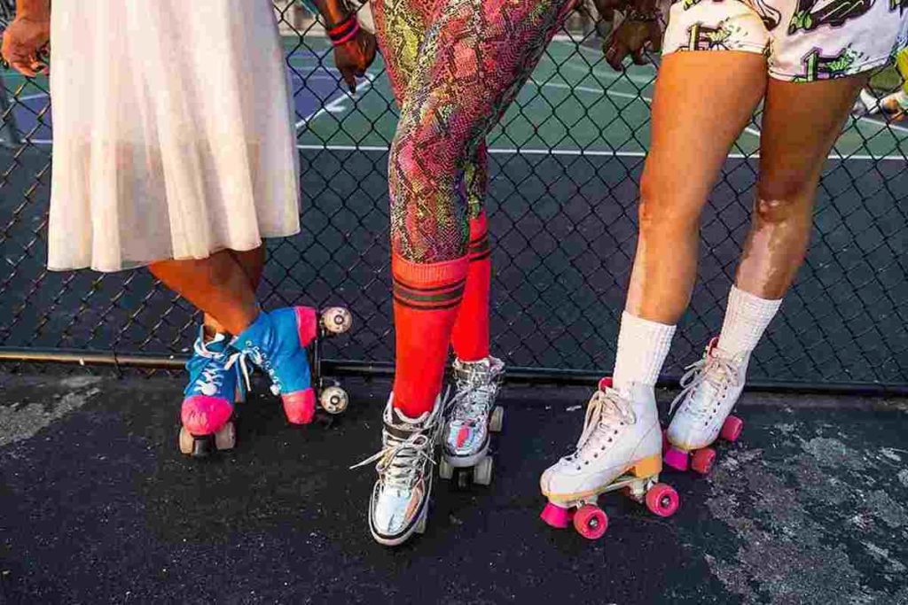 Three roller skaters show off their colorful skate shows as join other amazing women roller skating around Baltimore