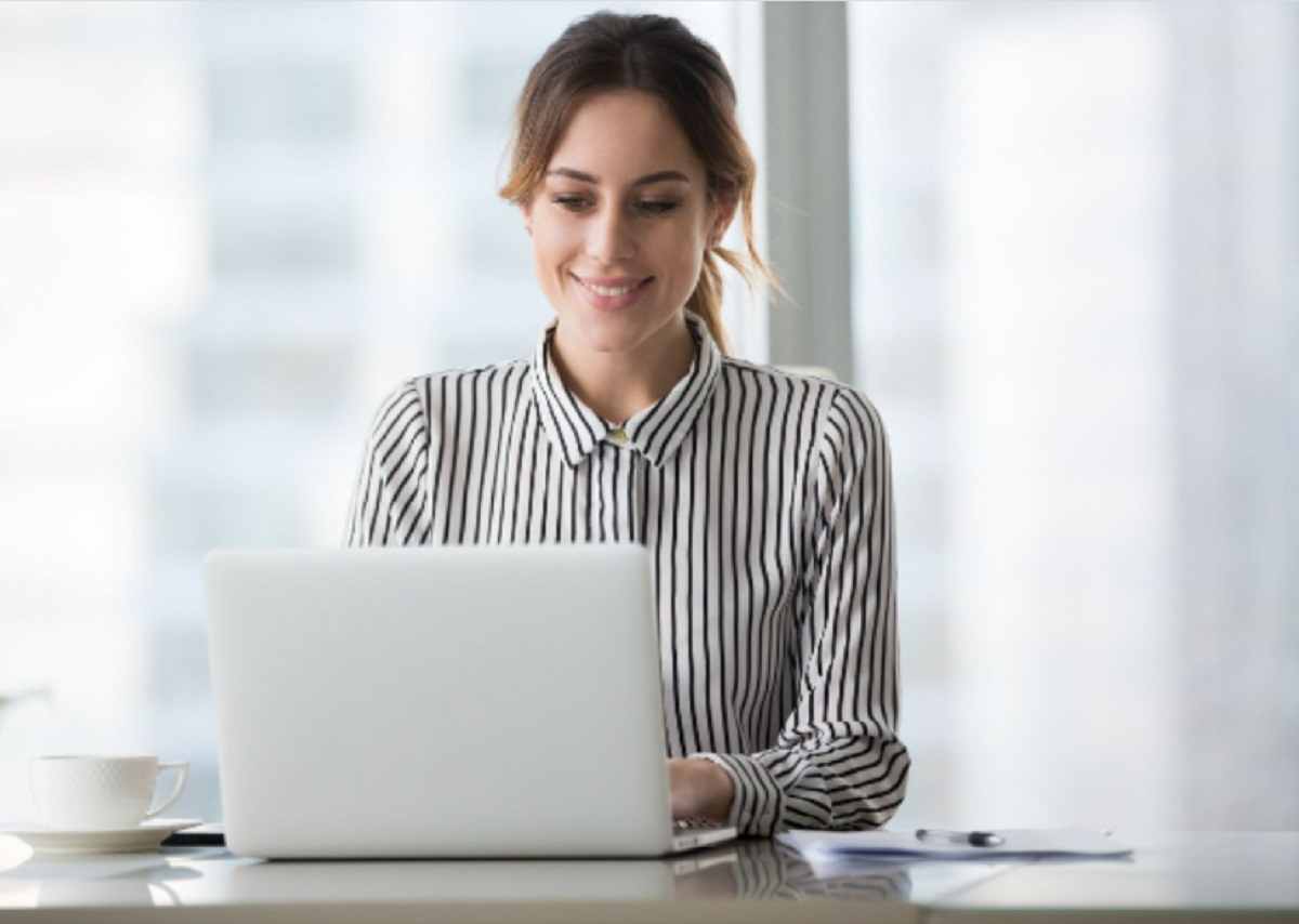 The lady on the laptop is a reminder that selling prints of your artwork online involves using social media platforms