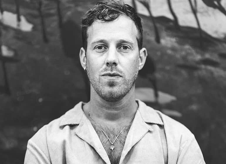 Black and white portrait ofTom Anholt in his studio