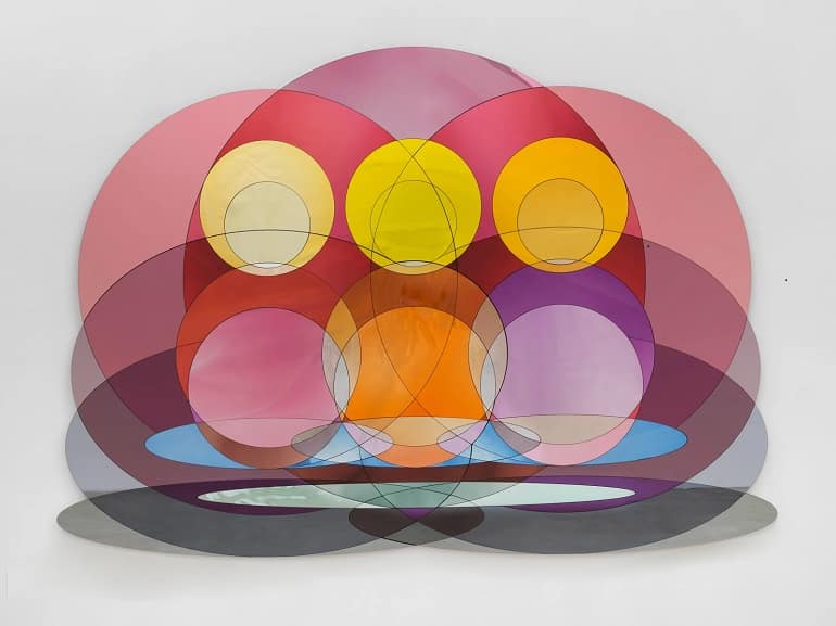 One of the fascinating works Art Basel 2024 is Olafur Eliasson's The Triple Presence Problem, a multi-layered color glass on display at Art Basel 2024