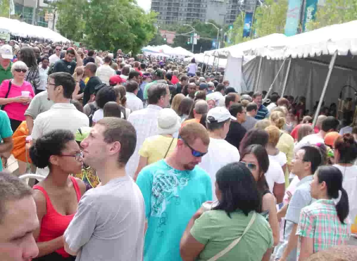 A crowd of art lovers at the Baltimore Artscape. What happens to this art event after A contract termination?
