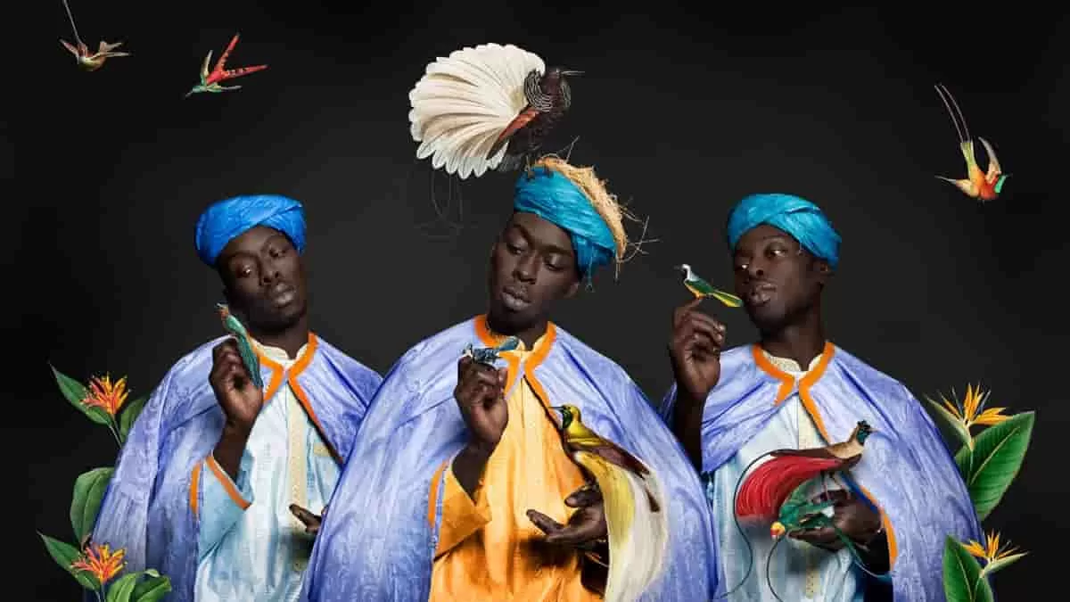 Omar Victor Diop in Allegoria 6 dressed as an African environmentalist surrounded by birds and other animals to raise questions about climate change