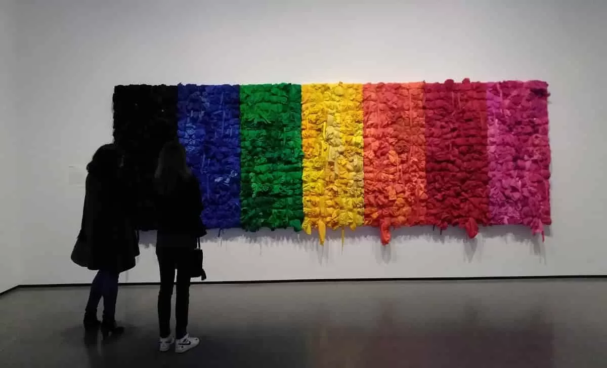 Art lovers looking at an artwork on display in a recent art exhibition at the Baltimore Museum of Art. BMA is one of the top Baltimore Art Museums.