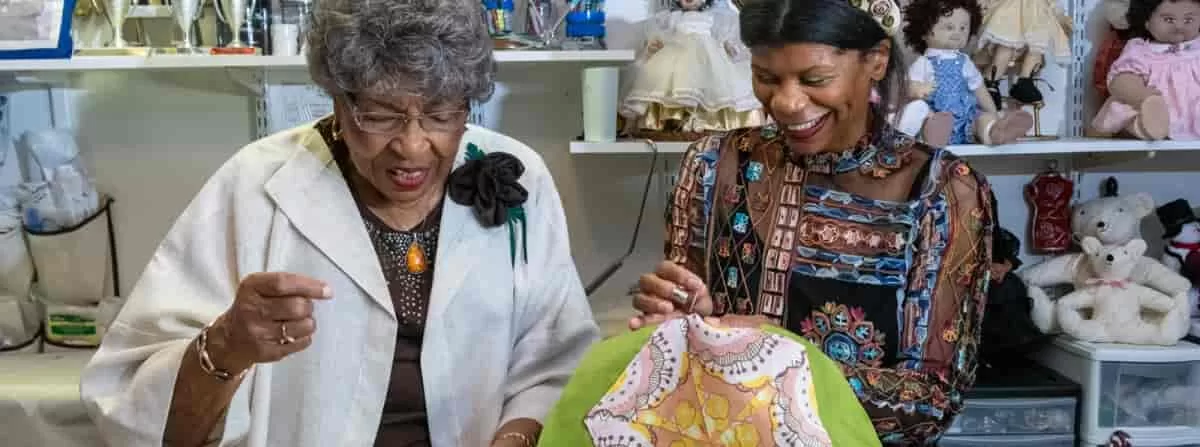 Mentor artist Catherine Wooten and artist Suzanne Coley during one of Maryland Traditions activities. The Maryland arts funding cuts may affect this program.