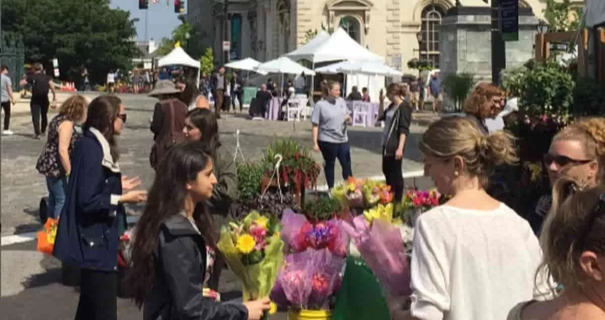 Flower lovers buying flowers at the Flower Mart at Mount-Vernon Place