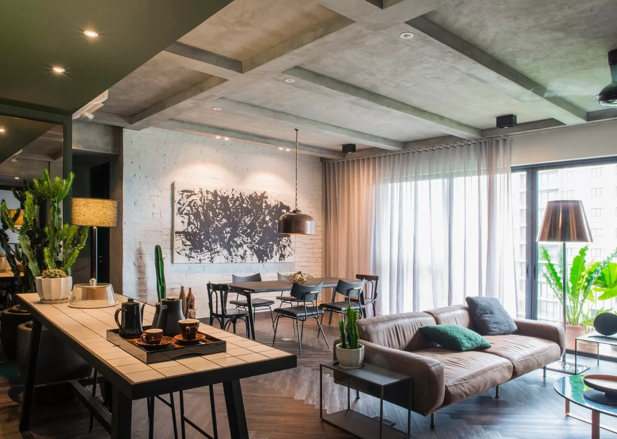 A contemporary home with concrete and industrial interior design accents. The living room connects to the outdoors. This an example of Personalizing Your Space With Custom Design Elements