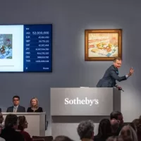 The auctioneer at work during the Sothebys auction where Frida Kahlo auction record put women artists on a strong pedestal.