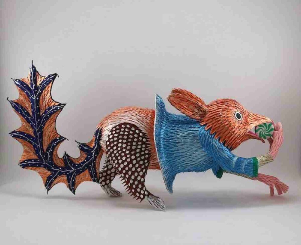 Craft in America Handwork: Roberto Benavidez's Illuminated Piñata No. 21 (2024), a colorful ceramic squirrel wearing a blue shirt and playfully eating a nut.
